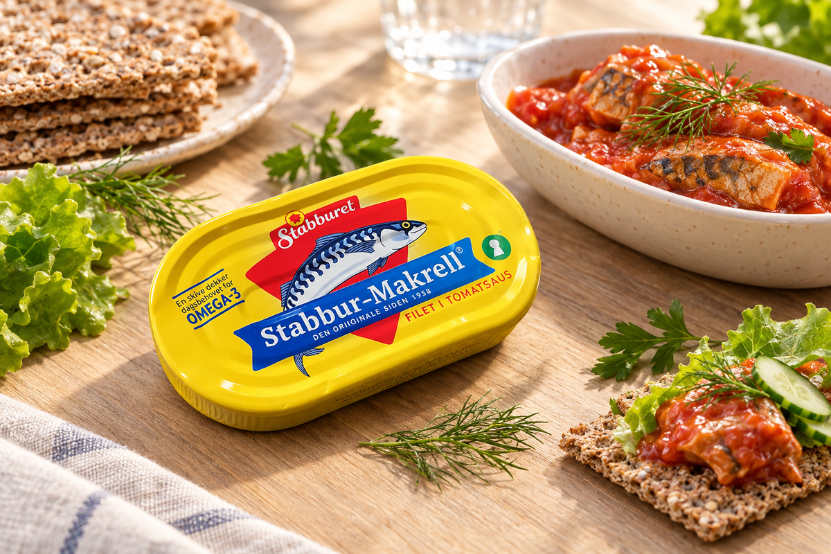 Stabbur-Makrell in tomato sauce with dill, parsley, lettuce and cucumber on a Norwegian breakfast table